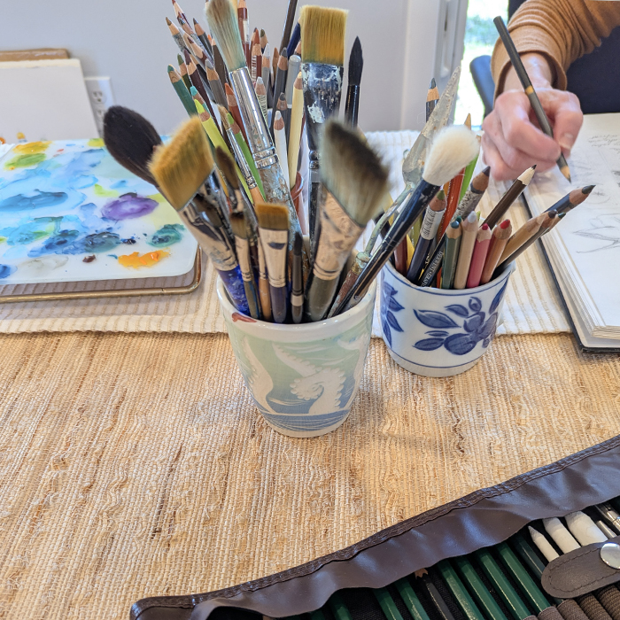 a close up of art supplies at Sketch Club