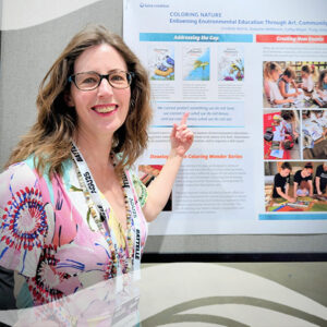 Cordelia Norris giving a poster presentation at the AGU conference in New Orleans