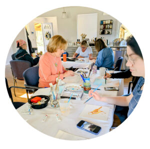 Group shot of artists painting at Sketch Club